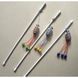 Cat teaser wand Mesh fish with pom-poms 50 cm, multicolour